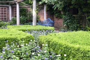 Beautiful landscaping surrounds a private swimming pool