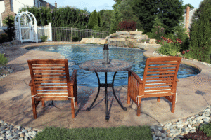 B&B Custom pool with two chairs.